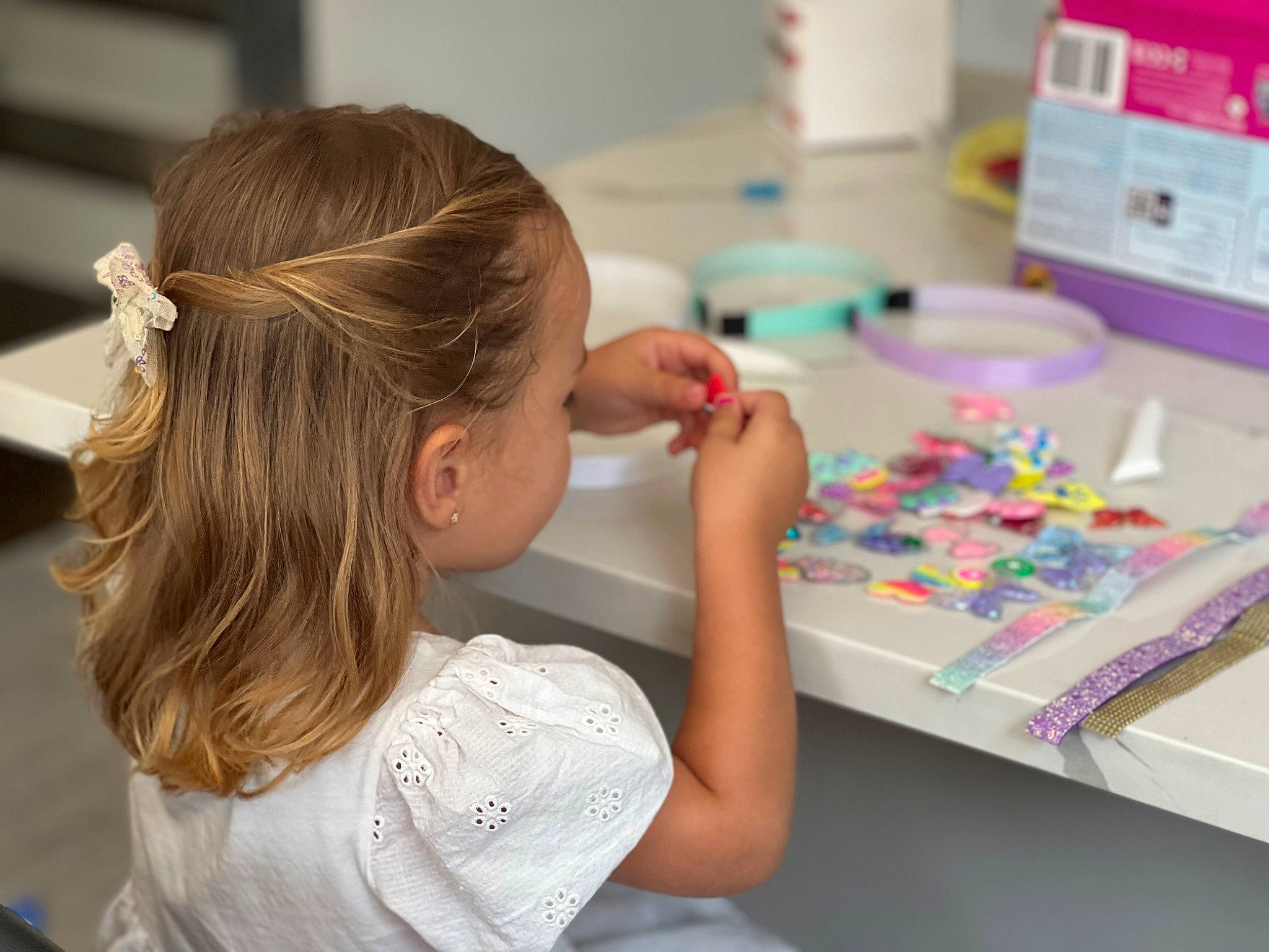 Adora is registered to the contest to win money with this photo: art, chair, child, curious, desk, eyelash, fun, hair_tie, learning, nail, person, play, ponytail, room, science, sharing, t_shirt, table, toddler, visual_arts