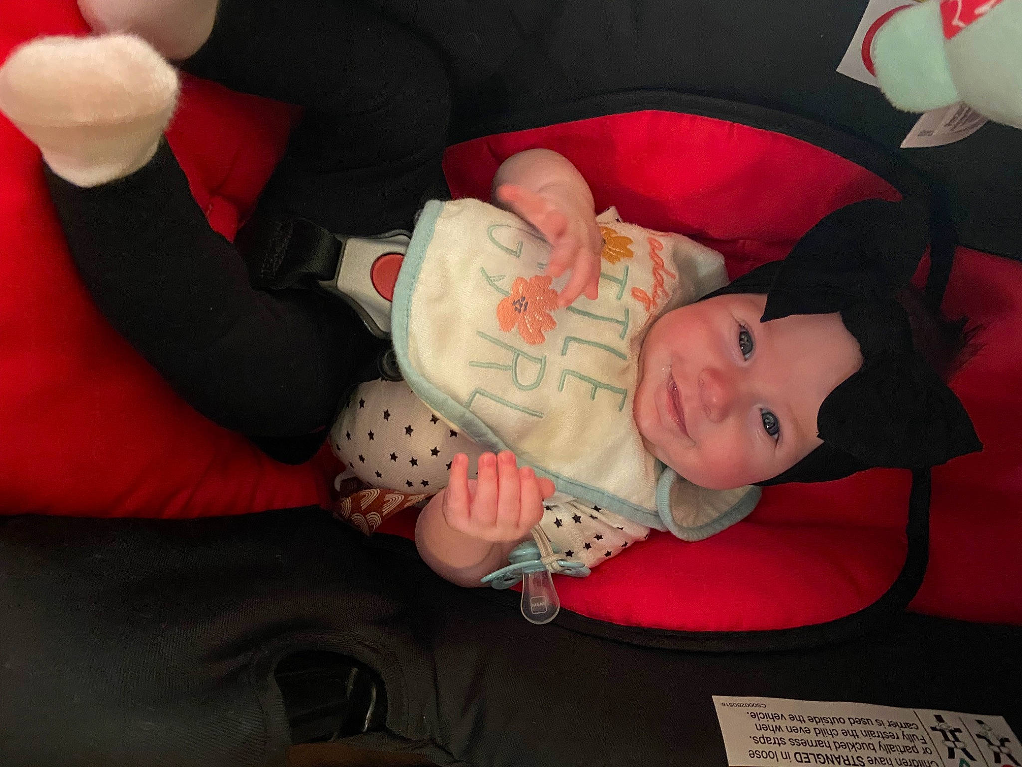 Raylee joined the competition — help win amazing prizes! baby, baby_products, baby_toddler_clothing, cheek, child, comfort, gesture, head, headwear, human_body, knee, lap, mammal, person, product, room, sleeve, sock, textile, thigh