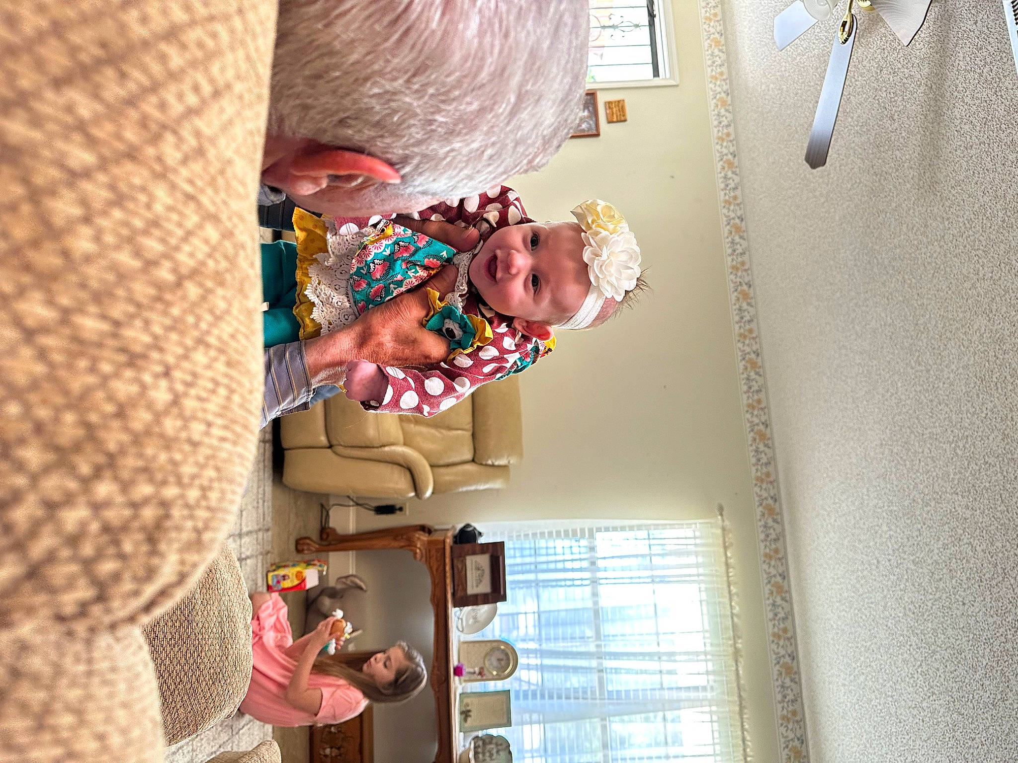 Raylee is registered to the contest to win money with this photo: child, comfort, flooring, fun, happy, pattern, person, room, toddler, visual_arts, window, wood, wool