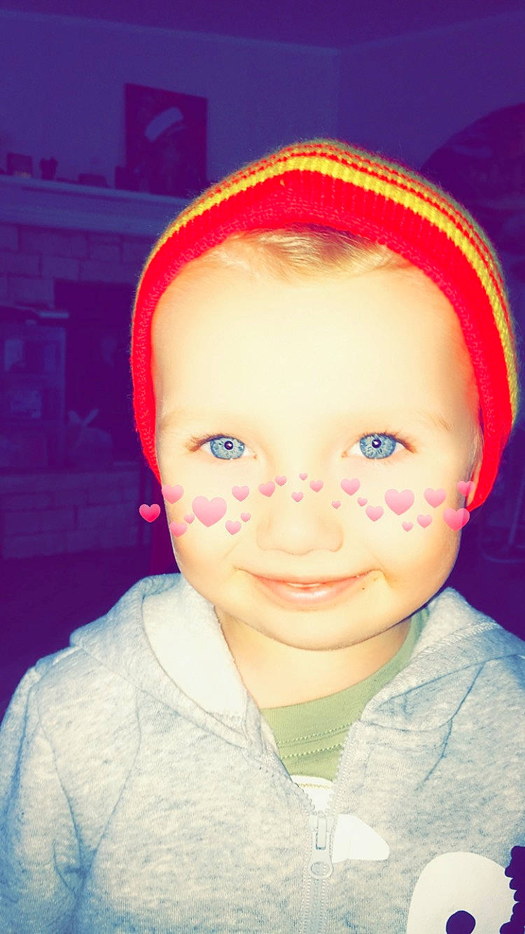 Logan joined the competition — help win amazing prizes! blue, cheek, child, chin, cool, eye, eyebrow, face, facial_expression, forehead, fun, head, headgear, lip, nose, person, pink, red, skin, smile