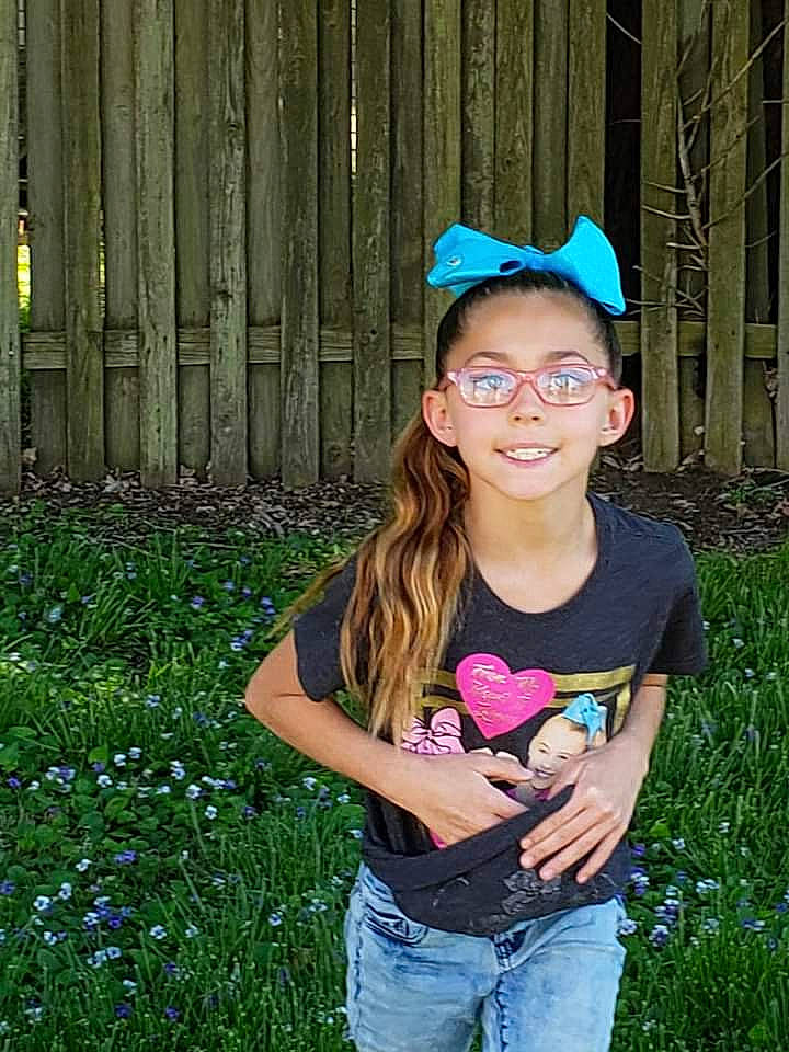 Hailey is registered to the contest to win money with this photo: child, clothing, electric_blue, eyewear, facial_expression, flash_photography, fruit, fun, glasses, grass, grassland, green, happy, joy, leaf, leisure, meadow, people_in_nature, person, plant