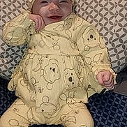 Nevaeh is registered to the contest to win money with this photo: baby, babylaughing, bodypart, bonnet, cap, clothing, couch, cushion, face, finger, furniture, happy, hat, head, homedecor, pajamas, person, photography, portrait, smile