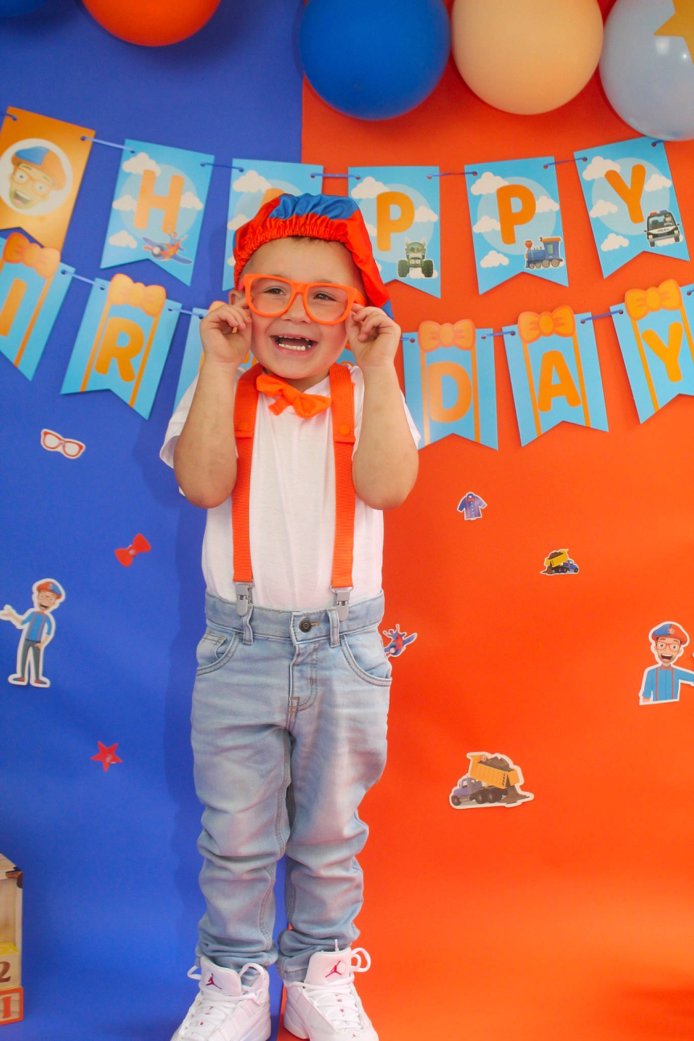 Dawson is registered to the contest to win money with this photo: balloon, blue, electric_blue, event, fashion_design, font, fun, gesture, happy, headwear, joy, leisure, orange, party_supply, pattern, people, person, product, sleeve, smile