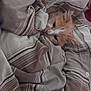 cat, orange_cat, white_cat, pet, cozy, blanket, striped_blanket, bedroom, resting, fur, cute, indoor, sleepy, comfortable, animal, domestic_cat, feline, soft, warm, hidden