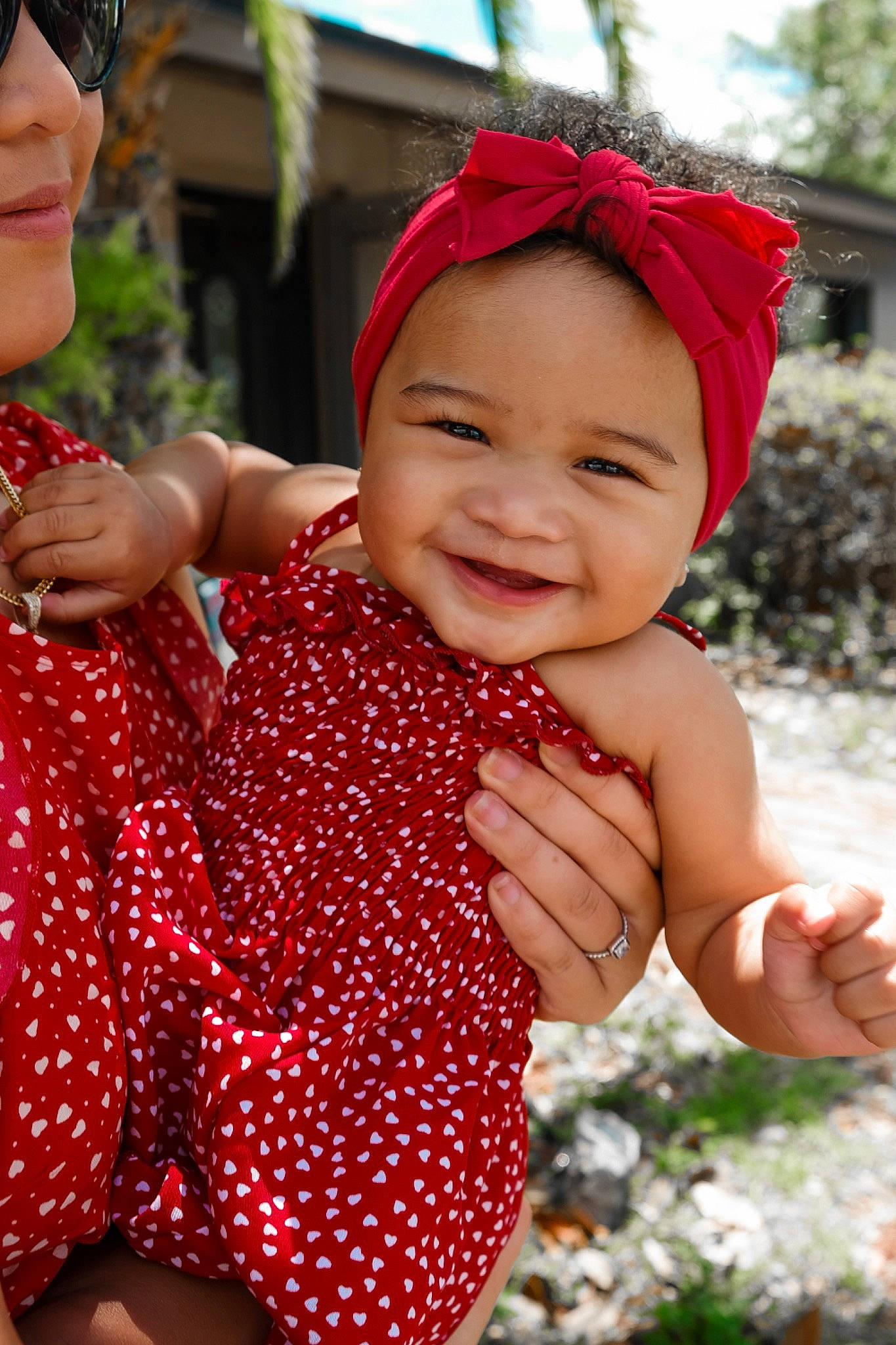 Elise joined the competition — help win amazing prizes! baby_toddler_clothing, cool, dress, face, facial_expression, finger, fun, gesture, grass, hand, happy, headwear, human, joy, leaf, organ, people_in_nature, person, plant, red