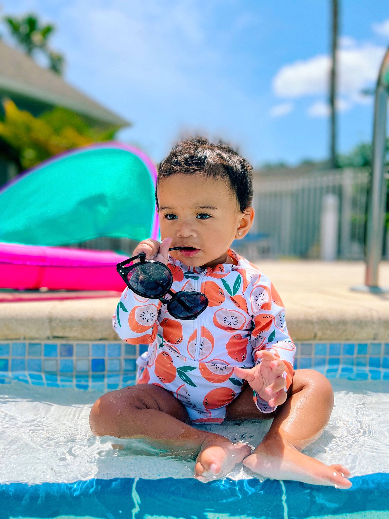 Elise joined the competition — help win amazing prizes! aqua, azure, baby, baby_toddler_clothing, blue, child, cloud, fun, grass, happy, leisure, person, personal_protective_equipment, product, recreation, sitting, sky, summer, swimming_pool, toddler