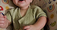 Rome joined the competition — help win amazing prizes! animal_print, baby, child, colorful, comfortable, cushion, cute, green_onesie, happy, indoor, infant, patterned, playful, portrait, rainbow, seat, smiling, straps, sun, young