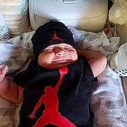 Maximilian joined the competition — help win amazing prizes! baby, infant, smiling, black_clothing, hat, red_logo, bottle, changing_pad, baby_care, aquaphor, diapers, face, sleeping, happy, newborn, indoors, person, resting, cute, small