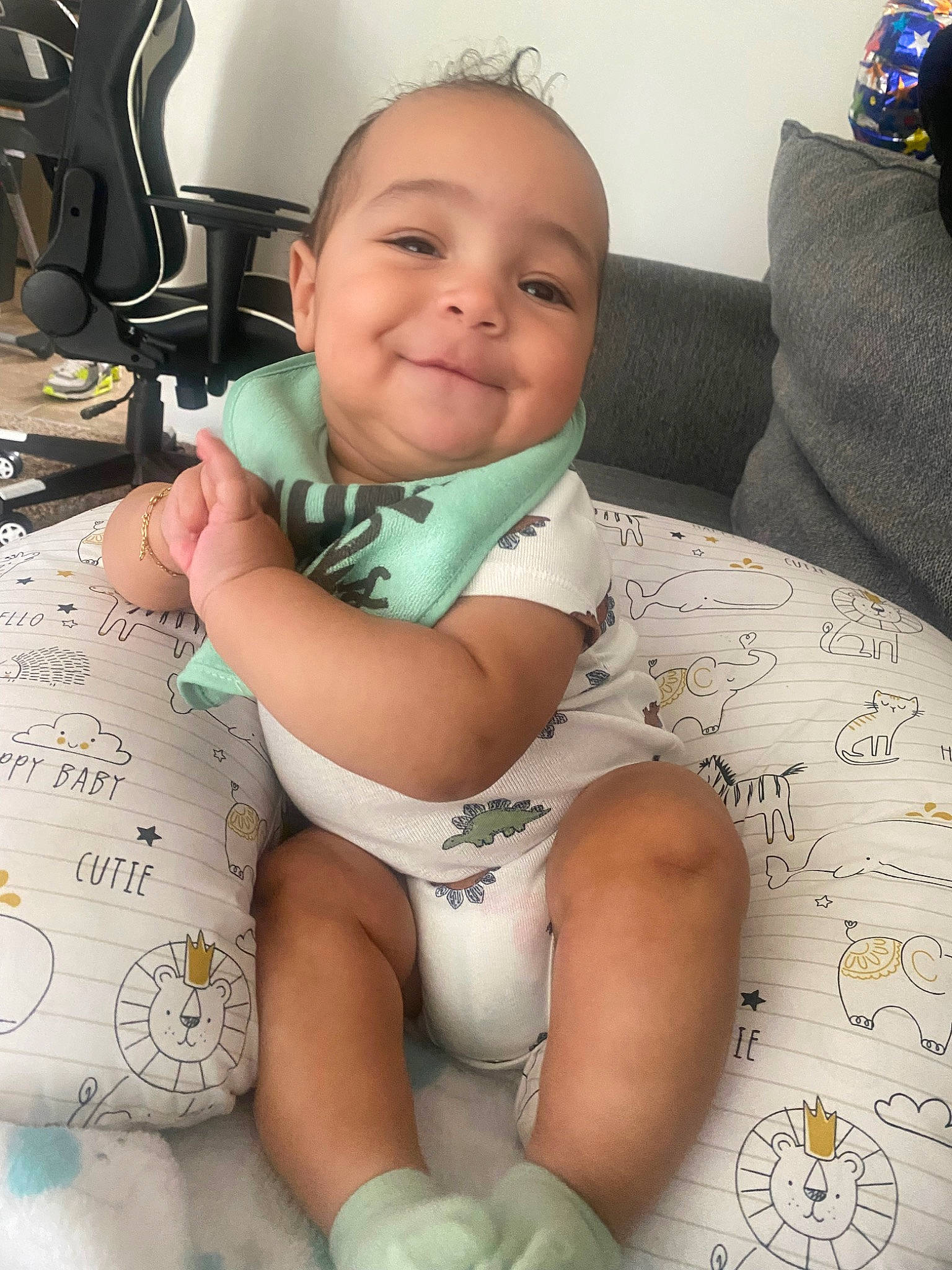 Messiah is registered to the contest to win money with this photo: baby, baby_toddler_clothing, cheek, chest, child, comfort, finger, happy, head, human_body, human_leg, joy, mouth, neck, person, sitting, skin, smile, thigh, thumb