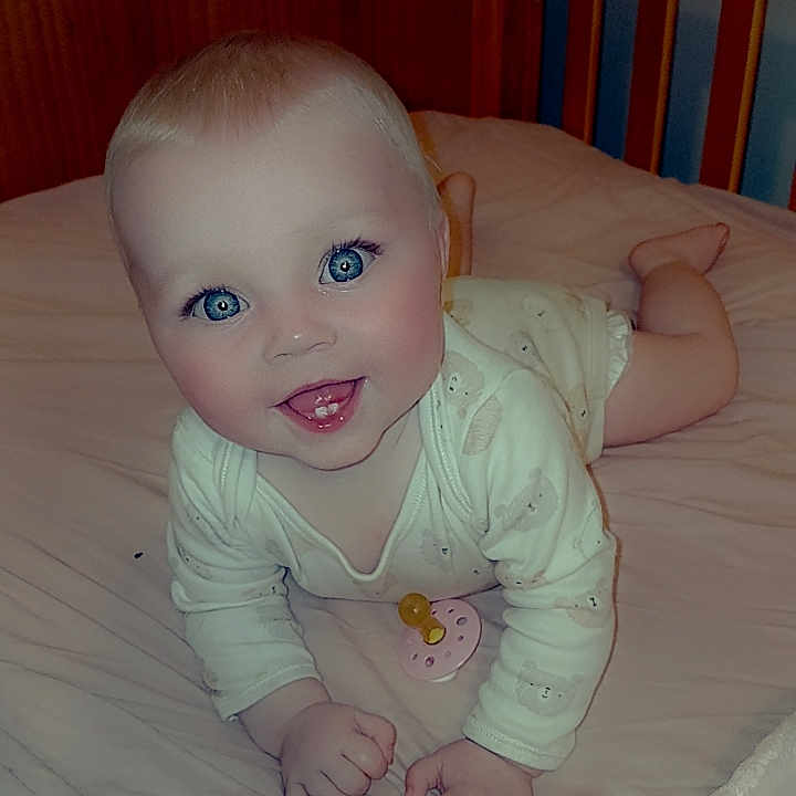 Layla-Maria is registered to the contest to win money with this photo: baby, bed, bedroom, bodypart, couch, crawling, crib, cushion, face, finger, furniture, hand, head, indoors, infantbed, person, photography, portrait, room, wood