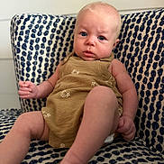 Creed joined the competition — help win amazing prizes! baby, child, infant, blue_eyes, brown_outfit, footwear, indoor, patterned_chair, seated, curious_expression, person, portrait, furniture, home, cute, young_child, skin, face, legs, hands