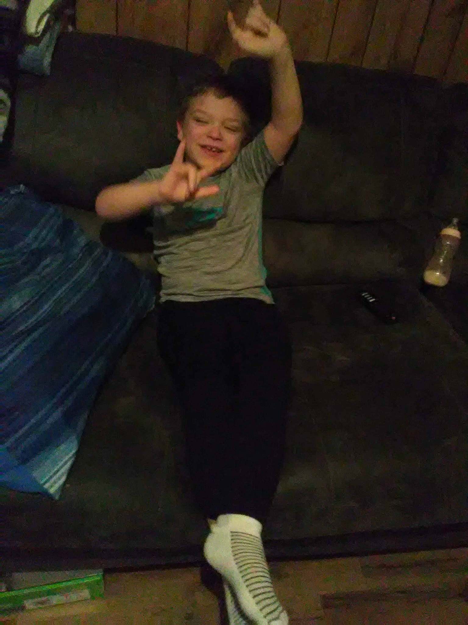 Connor is registered to the contest to win money with this photo: balance, barefoot, elbow, entertainment, event, flash_photography, floor, flooring, fun, gesture, human_leg, joint, joy, knee, leg, leisure, performing_arts, person, shoulder, standing