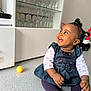 Aléa participe au concours pour gagner de l'argent avec cette photo : bodypart, cabinet, child, closet, clothing, cupboard, face, female, finger, furniture, girl, hand, head, jeans, pants, person, photography, portrait, shelf, sitting