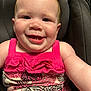 baby, child, smiling, face, pink_clothing, car_seat, infant, happy, cute, portrait, skin, person, cheerful, young, seat, fabric, pattern, closeup, head, expression