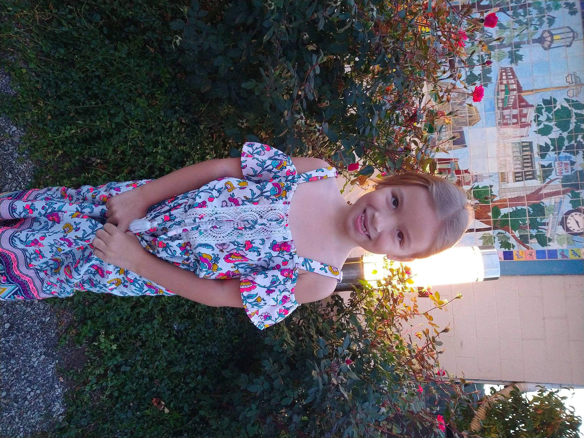 Hailey is registered to the contest to win money with this photo: baby_toddler_clothing, child, day_dress, dress, electric_blue, fun, grass, happy, human_leg, joy, leaf, leisure, magenta, pattern, people_in_nature, person, pink, plant, smile, toddler