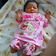 Rain is registered to the contest to win money with this photo: baby, newborn, infant, pink_clothing, cartoon_print, blanket, soft_texture, sleeping, cute, tiny_hands, white_socks, patterned_blanket, lying_down, indoors, cozy, child, person, portrait, sleep, resting