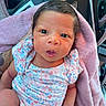 baby, car, car_interior, chevrolet_logo, child, closeup, cute, eyes, face, floral_clothing, hand, head, infant, newborn, person, pink_blanket, portrait, sitting, skin, steering_wheel