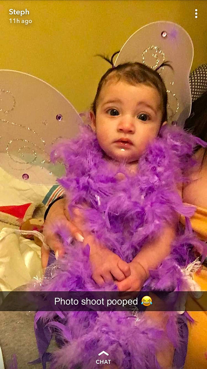 Gabriella joined the competition — help win amazing prizes! baby, cheek, child, costume, doll, face, hair_accessory, happy, head, iris, lavender, person, photo_caption, photography, purple, smile, toddler, violet