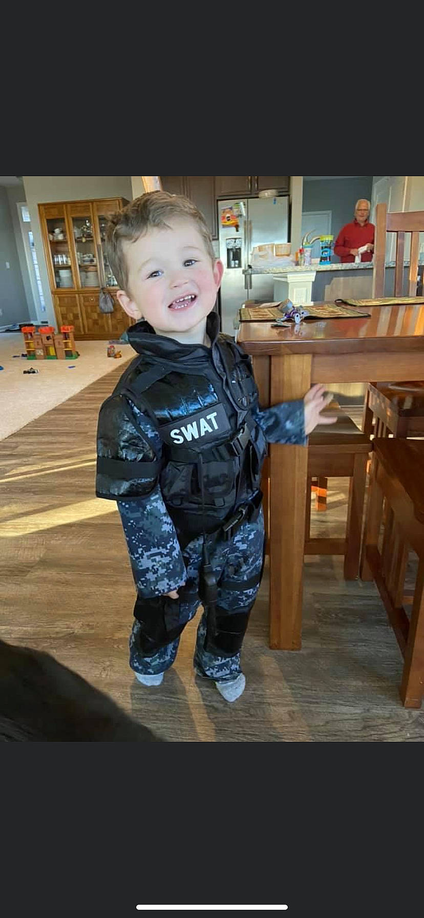 Caleb joined the competition — help win amazing prizes! baby_toddler_clothing, blurred, child, denim, electric_blue, flooring, fun, hardwood, houseplant, jacket, person, room, shelf, sitting, sleeve, smile, t_shirt, table, toddler, varnish