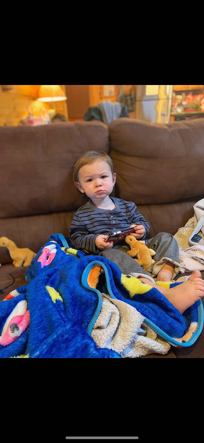 Rhyder is registered to the contest to win money with this photo: baby, baby_products, chair, child, comfort, couch, electric_blue, event, fun, lap, leisure, person, play, recreation, room, sitting, stuffed_toy, toddler, vacation