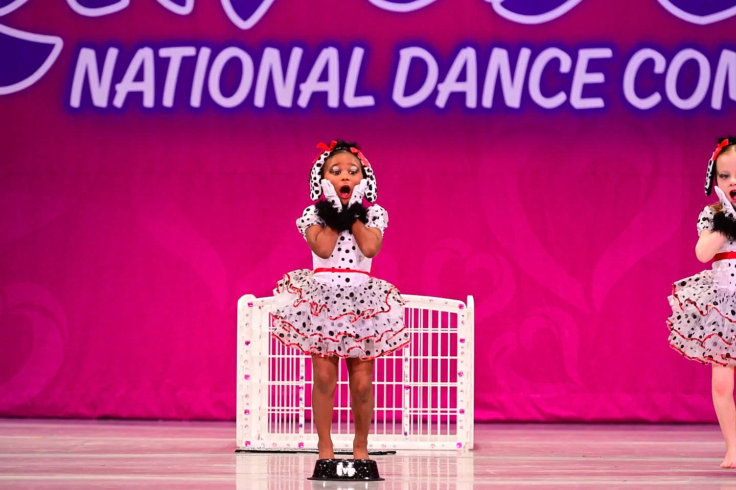 Evie joined the competition — help win amazing prizes! chair, choreography, competition, dancer, drama, dress, entertainment, event, fashion_design, font, fun, magenta, music, performance_art, performing_arts, person, pink, public_event, red, stage