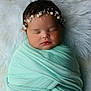 newborn, baby, sleeping, wrapped, blanket, headband, pearl, soft, mint_green, white, fur, cozy, portrait, infant, peaceful, cute, face, resting, child, closeup