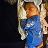 Kyliee joined the competition — help win amazing prizes! baby, newborn, sleeping, blue_onesie, headband, bow, floral_pattern, hand, blanket, person, close_up, indoor, cozy, resting, cute, infant, soft_lighting, peaceful, portrait, child