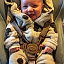 baby, infant, child, smiling, fleece, onesie, hood, car_seat, seatbelt, straps, cozy, cute, happy, indoor, blue_clothing, plush, soft, sitting, person, portrait