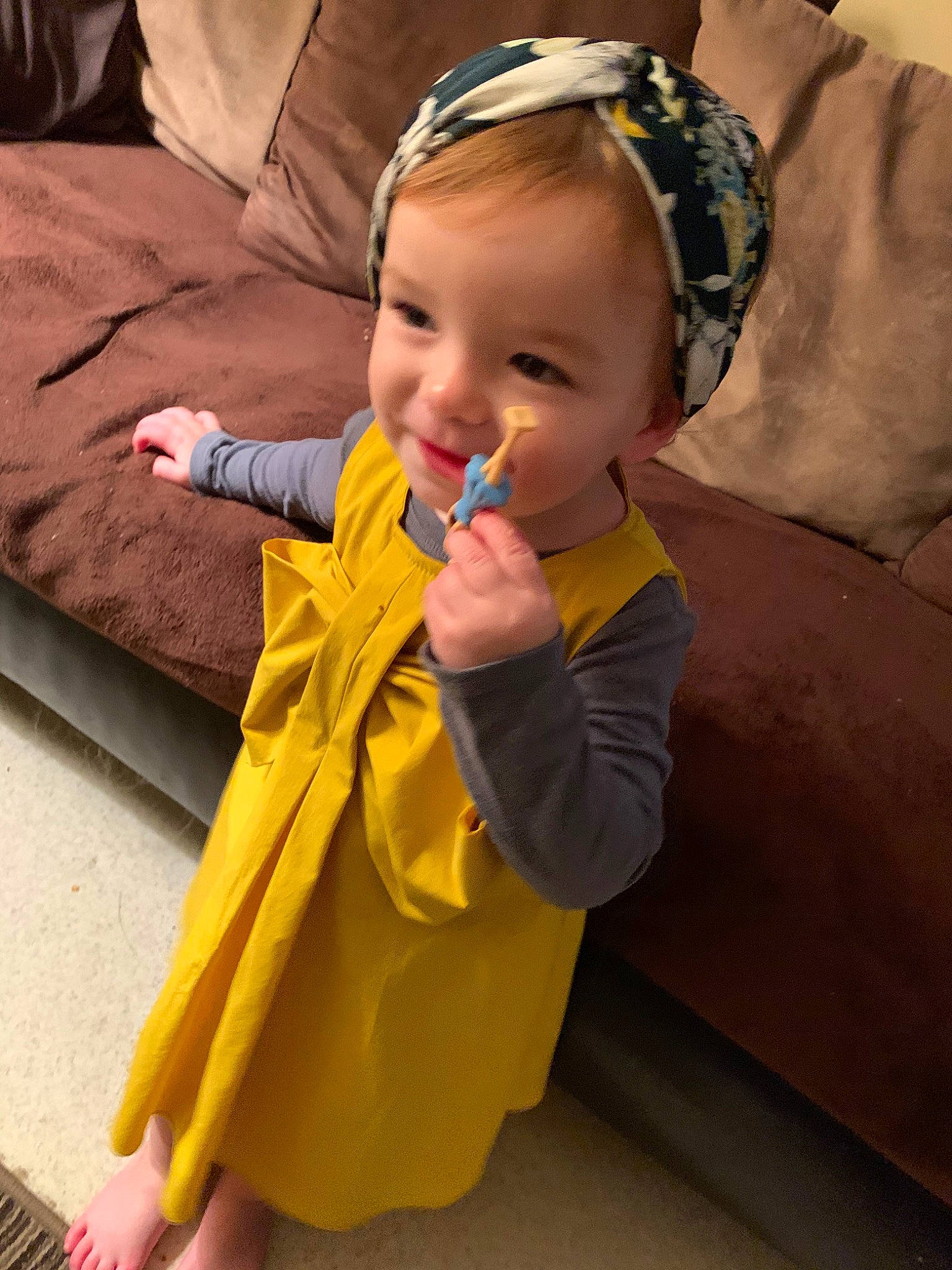 Bud is registered to the contest to win money with this photo: baby, child, hair_accessory, headband, headgear, joy, outerwear, person, toddler, yellow