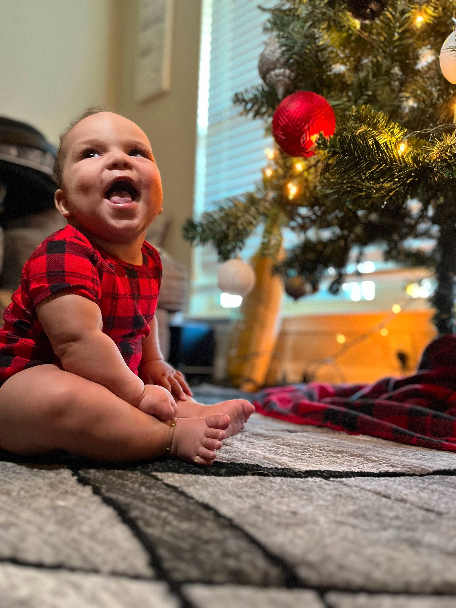 Amoni joined the competition — help win amazing prizes! baby, christmas_decoration, christmas_ornament, christmas_tree, event, flooring, foot, happy, holiday, holiday_ornament, human_body, human_leg, leaf, ornament, person, plant, smile, snapshot, toddler, tree