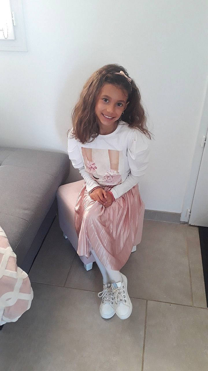 Shayna participe au concours pour gagner de l'argent avec cette photo : baby_toddler_clothing, blond, day_dress, embellishment, fashion_design, flash_photography, floor, flooring, formal_wear, happy, human_leg, joy, knee, magenta, one_piece_garment, person, sleeve, smile, sock, thigh