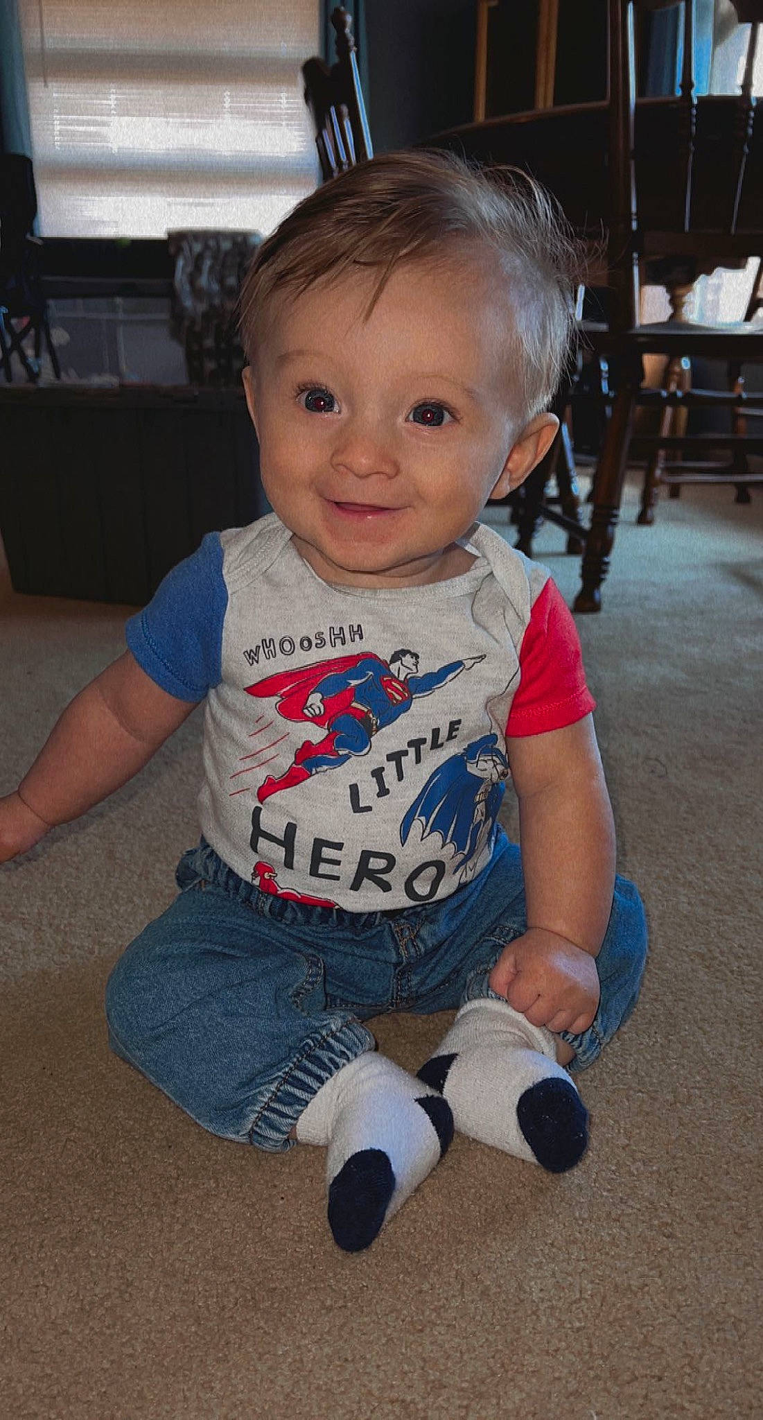 Jameson is registered to the contest to win money with this photo: baby, baby_toddler_clothing, cheek, child, chin, finger, floor, flooring, fun, happy, head, human_leg, iris, joy, person, sitting, skin, sleeve, smile, sock