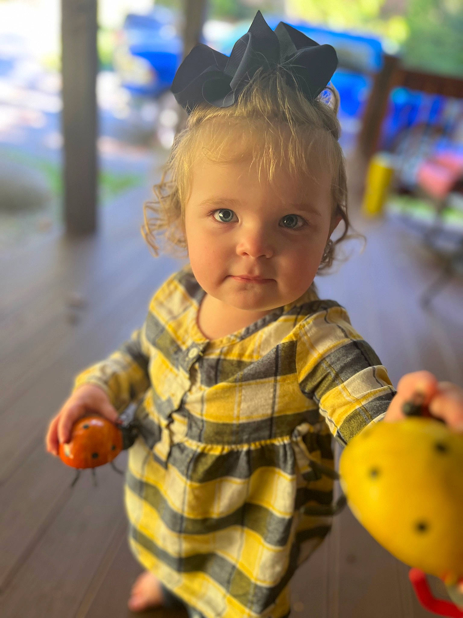 Laura is registered to the contest to win money with this photo: baby, ball, child, city, eyewear, fashion_accessory, fun, grass, happy, leisure, pattern, person, play, recreation, skin, sports_toy, toddler, toy, vacation, wood