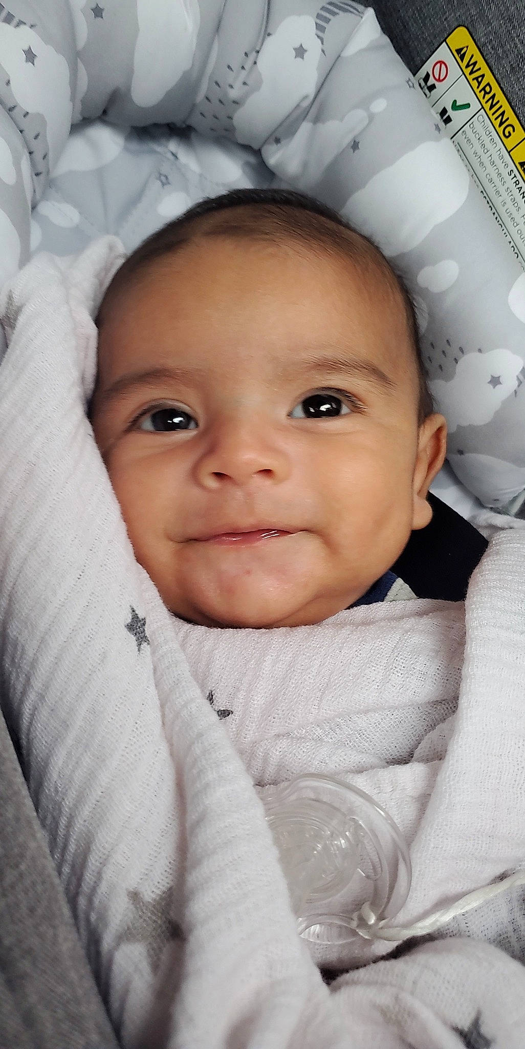 Lucifer is registered to the contest to win money with this photo: baby, baby_toddler_clothing, cheek, child, close_up, comfort, eye, eyebrow, eyelash, face, flash_photography, happy, iris, joy, nose, person, product, skin, sleeve, smile