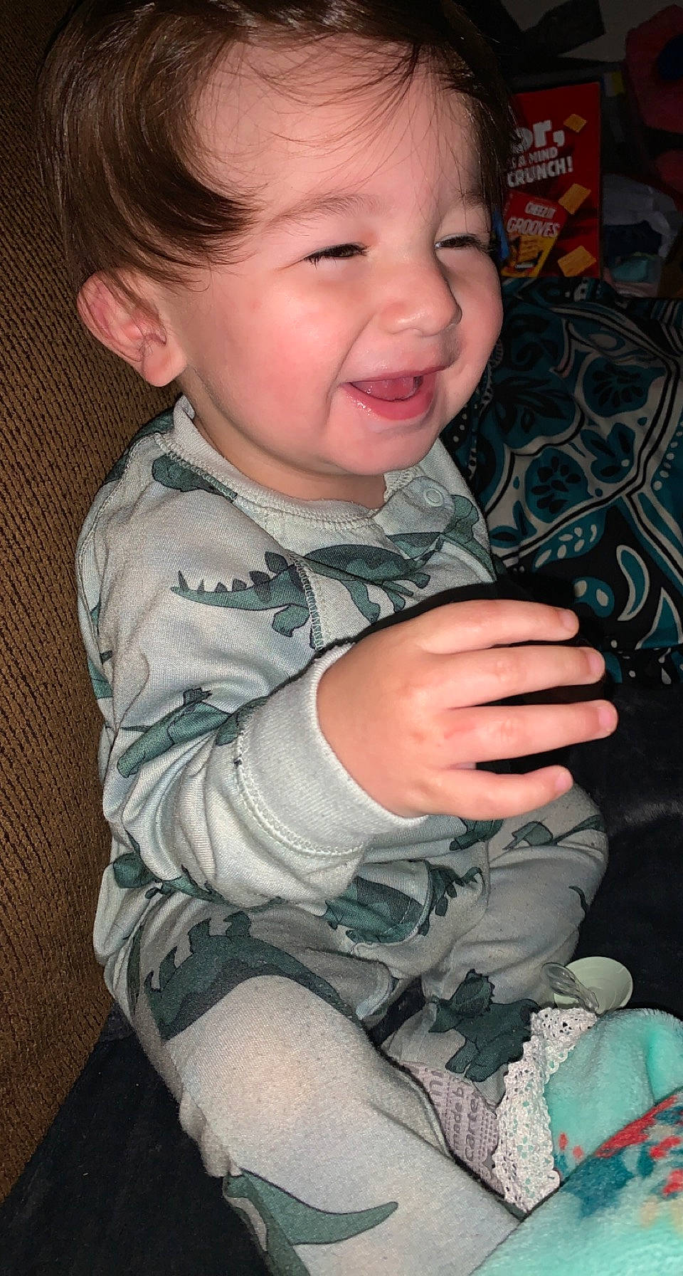 Parker is registered to the contest to win money with this photo: arm, baby_toddler_clothing, cheek, chin, eyebrow, hair, hairstyle, hand, head, human_body, iris, lip, mouth, nose, organ, person, product, skin, sleeve, smile