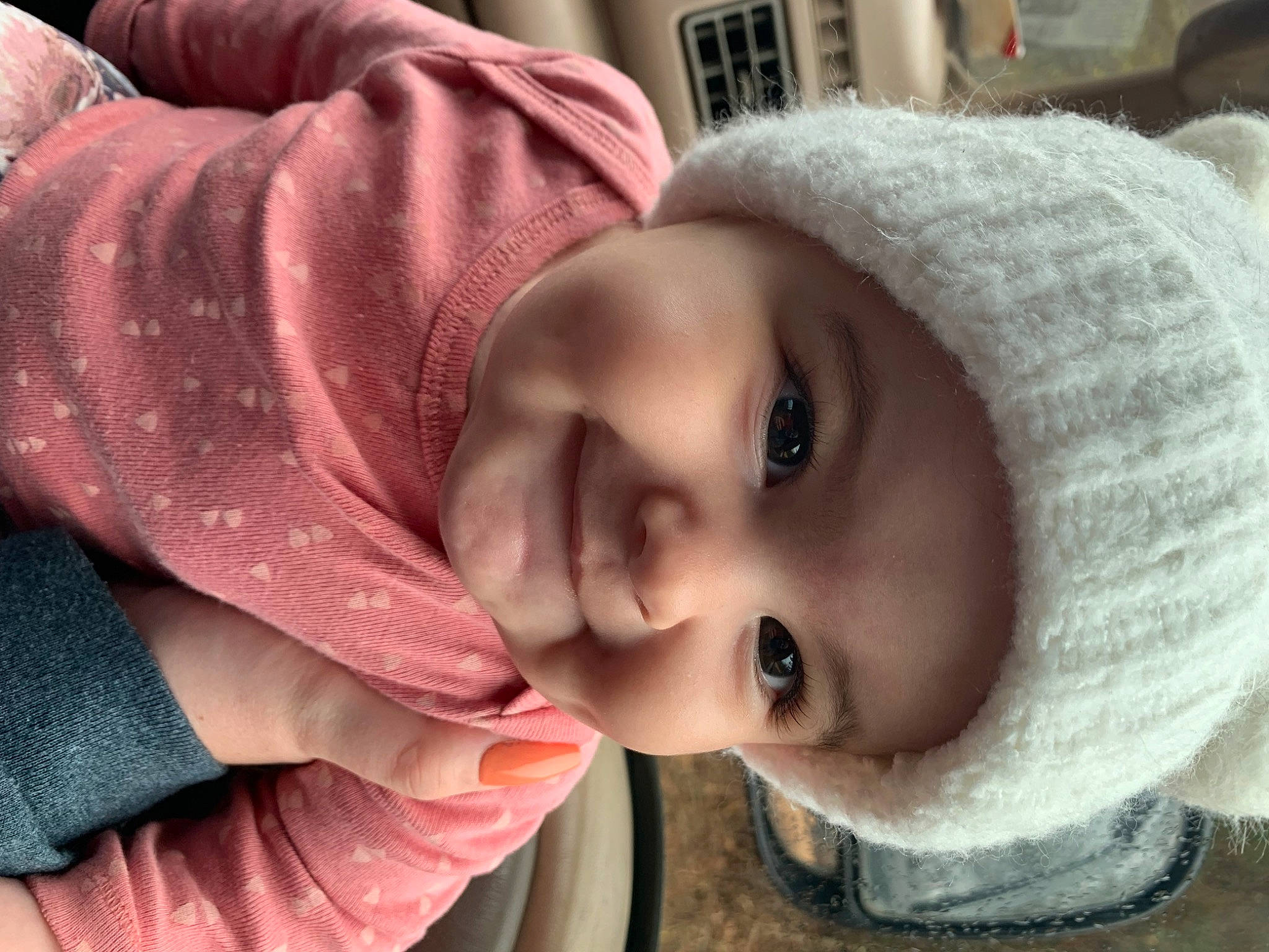 Bailee is registered to the contest to win money with this photo: cap, cheek, chin, eye, eyebrow, eyelash, face, facial_expression, gesture, happy, head, headwear, iris, joy, lip, mouth, nose, outerwear, person, plant