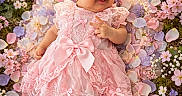 Susej joined the competition — help win amazing prizes! baby, infant, child, portrait, smiling, pink_dress, lace, headband, bow, flowers, garden, pastel, cherry_blossoms, flower_petals, floral_background, sitting, outdoor, sunlight, bokeh, cute