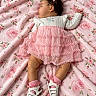 Susej joined the competition — help win amazing prizes! baby, sleeping, infant, portrait, pink, floral, blanket, dress, bow, curly_hair, child, lying_down, fashion, sandals, socks, ruffles, roses, indoors, cute, photography