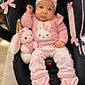 Susej is registered to the contest to win money with this photo: baby, infant, child, portrait, smiling, wide_eyed, pink, bunny, rabbit, headband, sweater, plush_toy, stuffed_animal, car_seat, sitting, indoors, baby_clothing, bunny_slippers, pastel_colors, cute