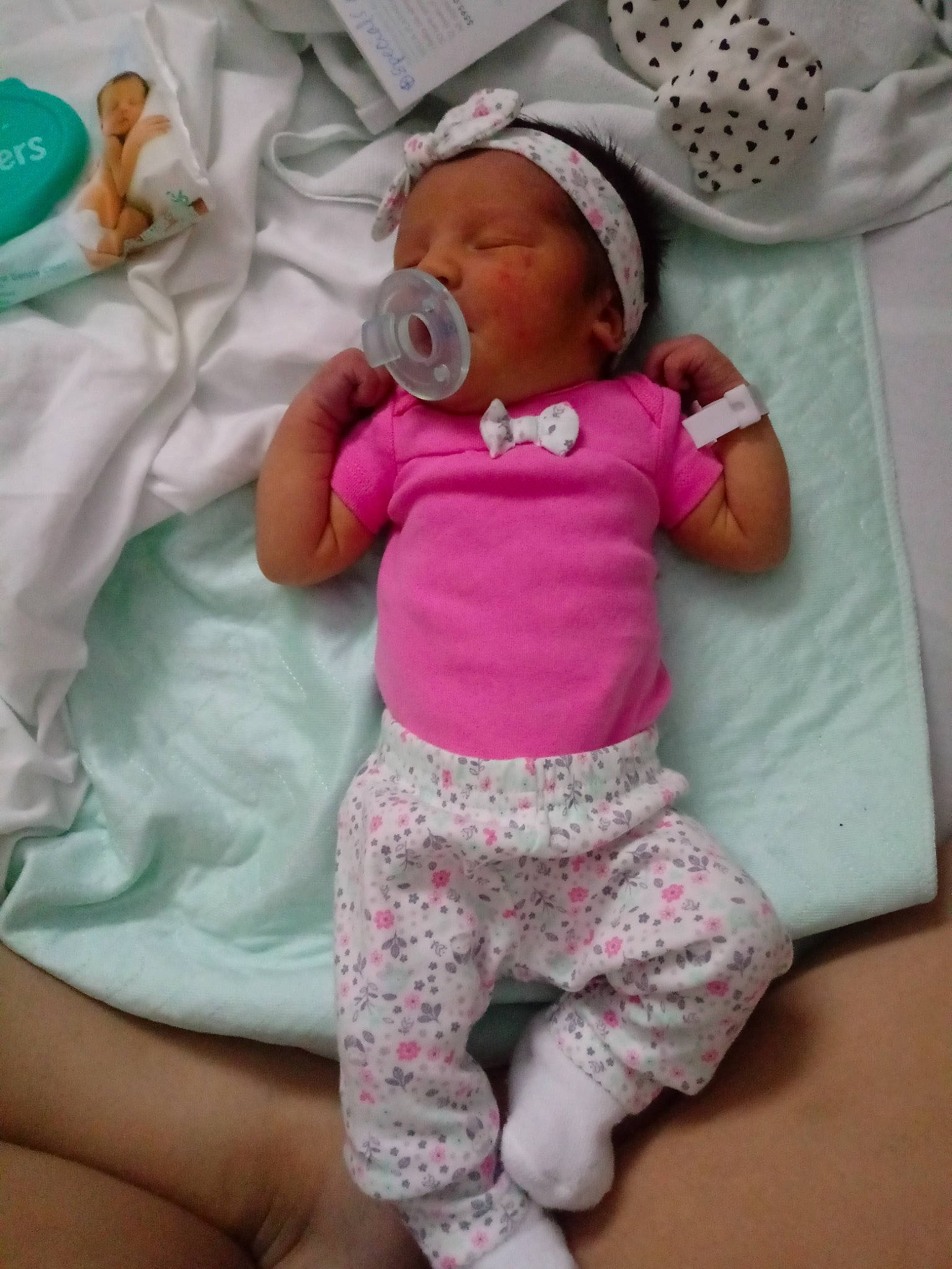 Mia Quinn joined the competition — help win amazing prizes! baby, baby_products, baby_safety, baby_sleeping, baby_toddler_clothing, cheek, child, comfort, happy, hat, head, linens, pattern, person, pink, room, skin, sleeve, textile, toddler