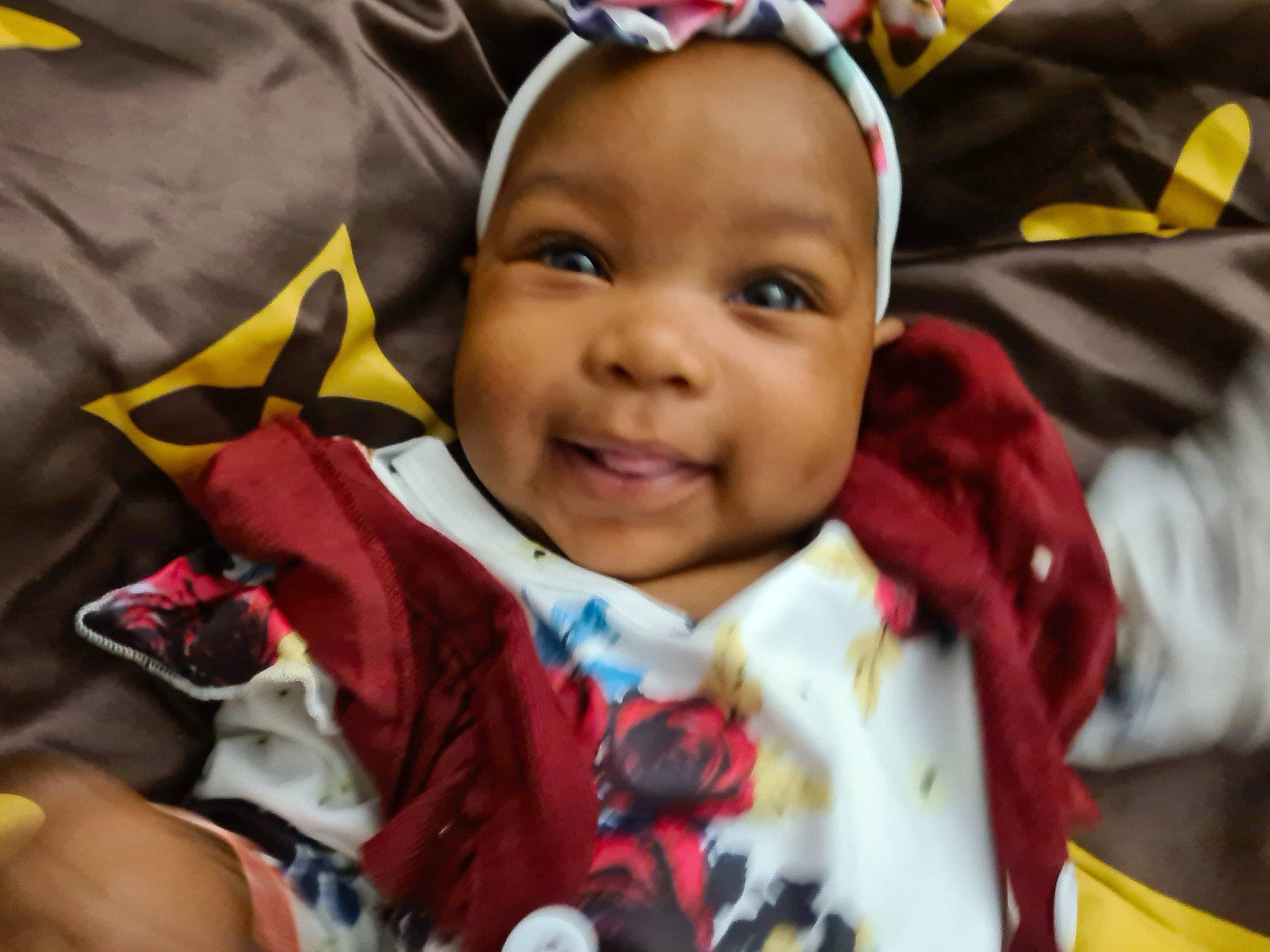 Naya participe au concours pour gagner de l'argent avec cette photo : baby, baby_products, baby_toddler_clothing, cheek, child, event, eye, face, fashion_accessory, fun, happy, head, iris, joy, outerwear, person, skin, sleeve, smile, textile