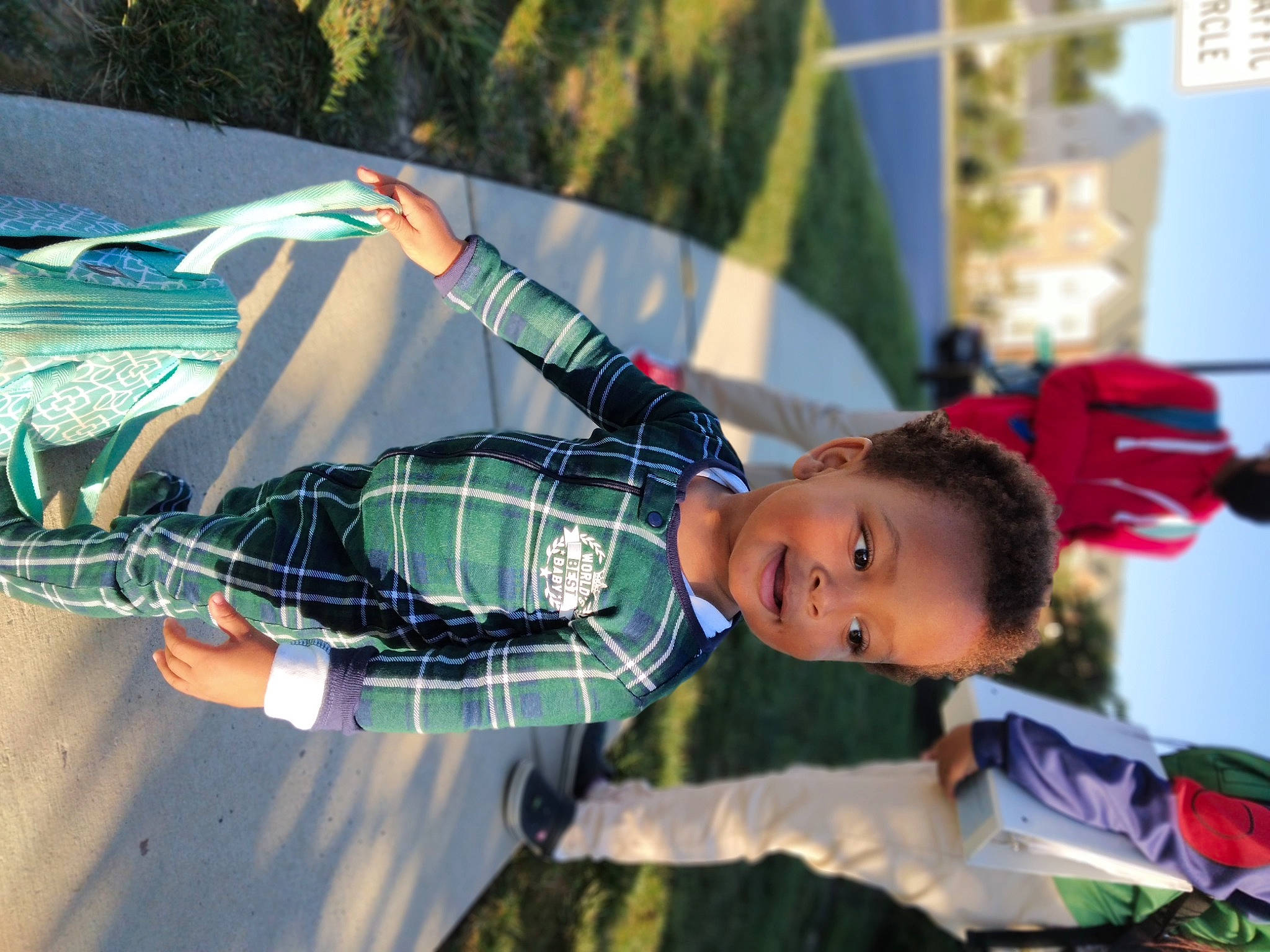 Shane is registered to the contest to win money with this photo: child, competition_event, electric_blue, event, fun, grass, happy, joy, leisure, pattern, person, plaid, play, recreation, smile, tartan, textile, toddler, tree, vacation