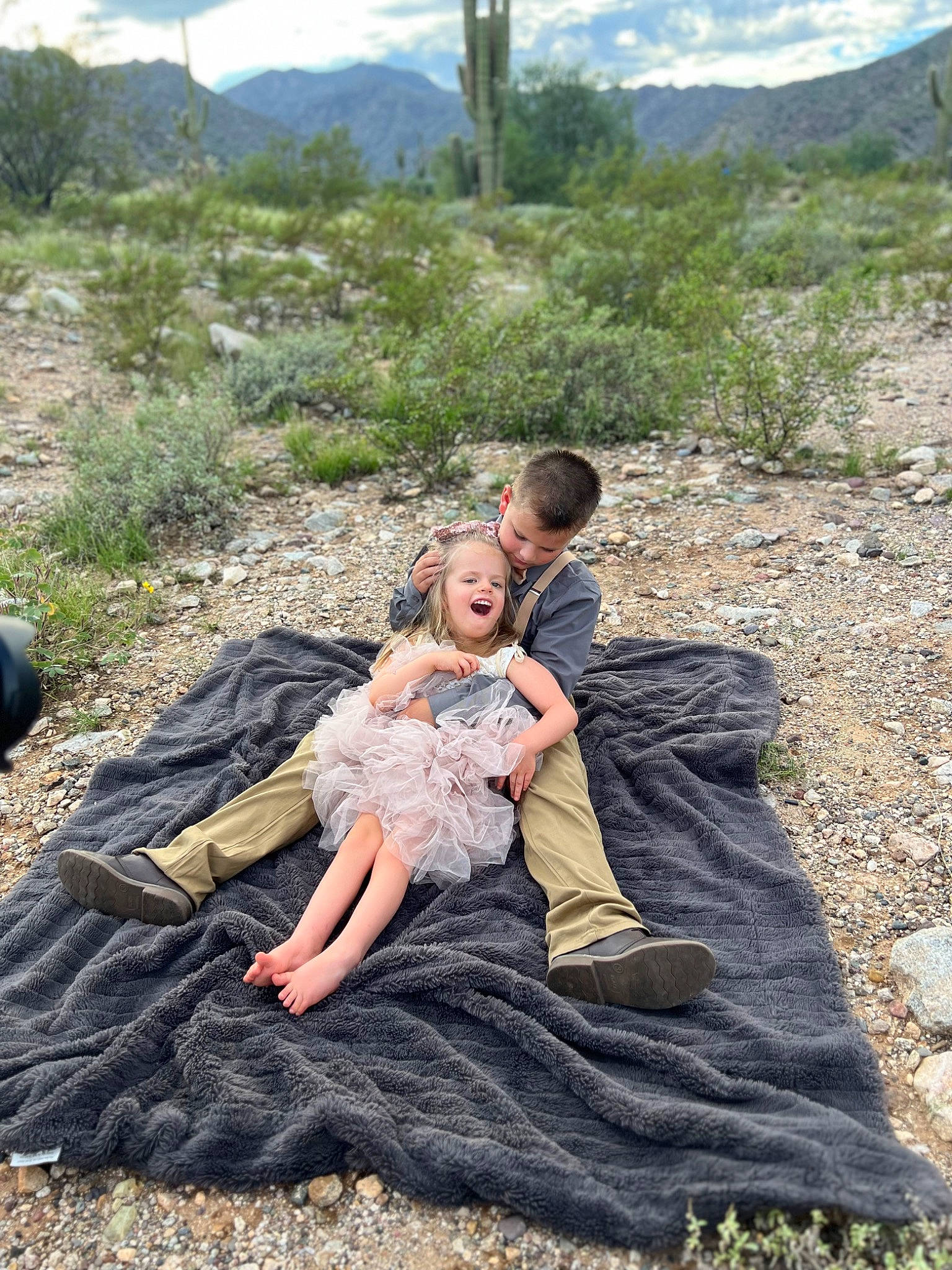 Eviana is registered to the contest to win money with this photo: cloud, dress, ecoregion, event, formal_wear, friendship, grass, grassland, happy, hill, landscape, leisure, mountain, natural_environment, people_in_nature, person, plant, recreation, sky, soil