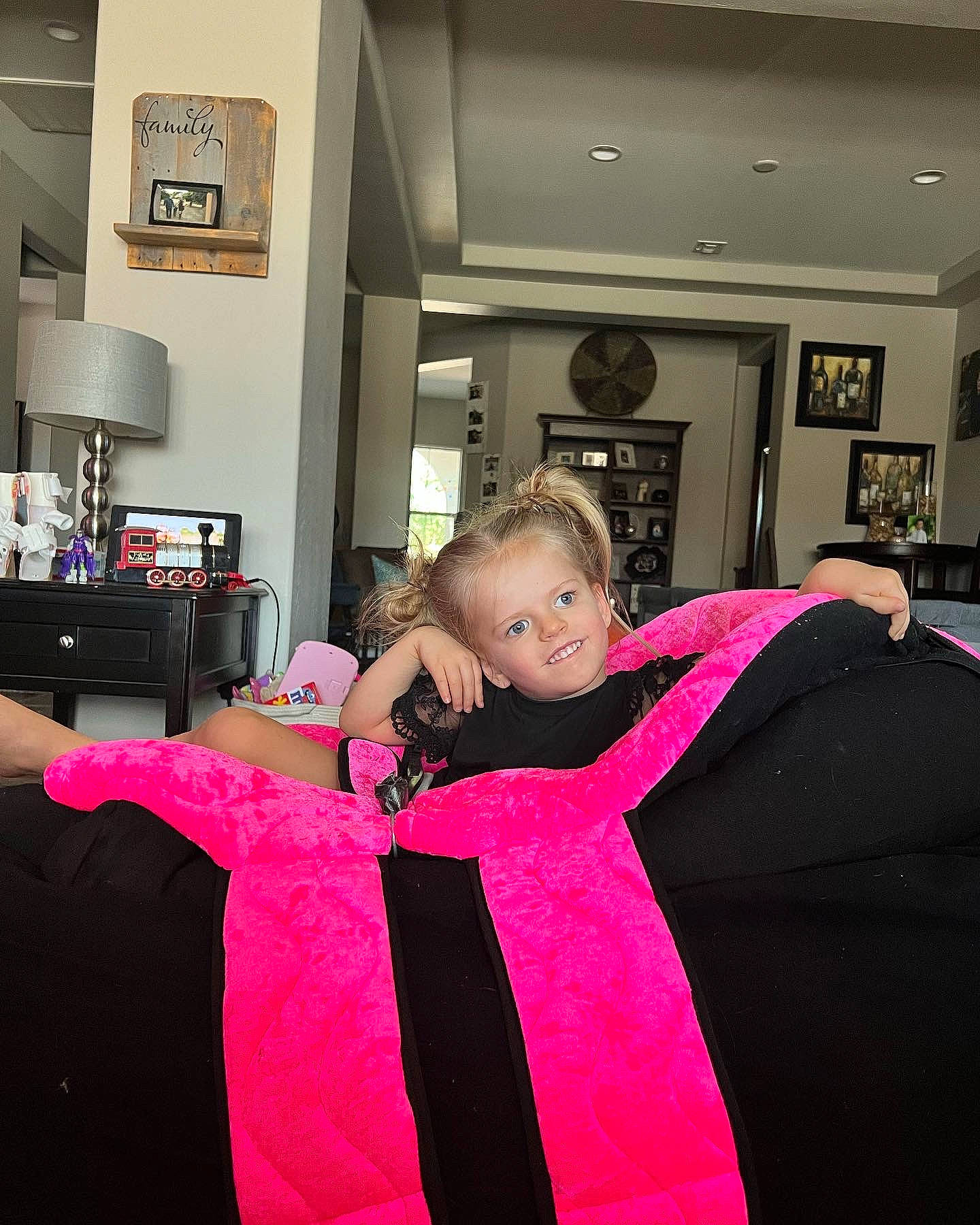 Eviana is registered to the contest to win money with this photo: bedding, child, comfort, event, fashion_design, flooring, formal_wear, fun, happy, home_appliance, interior_design, joy, leisure, linens, magenta, pattern, person, picture_frame, pink, room