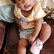 Olivia joined the competition — help win amazing prizes! baby, child, couch, curly_hair, flower, furniture, hair_clips, indoors, minnie_mouse, photography, pink_shoes, portrait, shirt, shorts, sitting, smiling, sneakers, striped_clothing, toddler, wide_eyed