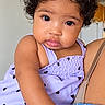 Olivia joined the competition — help win amazing prizes! adult, baby, blue_clothing, caregiver, child, close_up, curly_hair, face, family, hair_bow, hand, heart_pattern, indoors, infant, kitchen, lavender_dress, photography, portrait, sitting, smiling