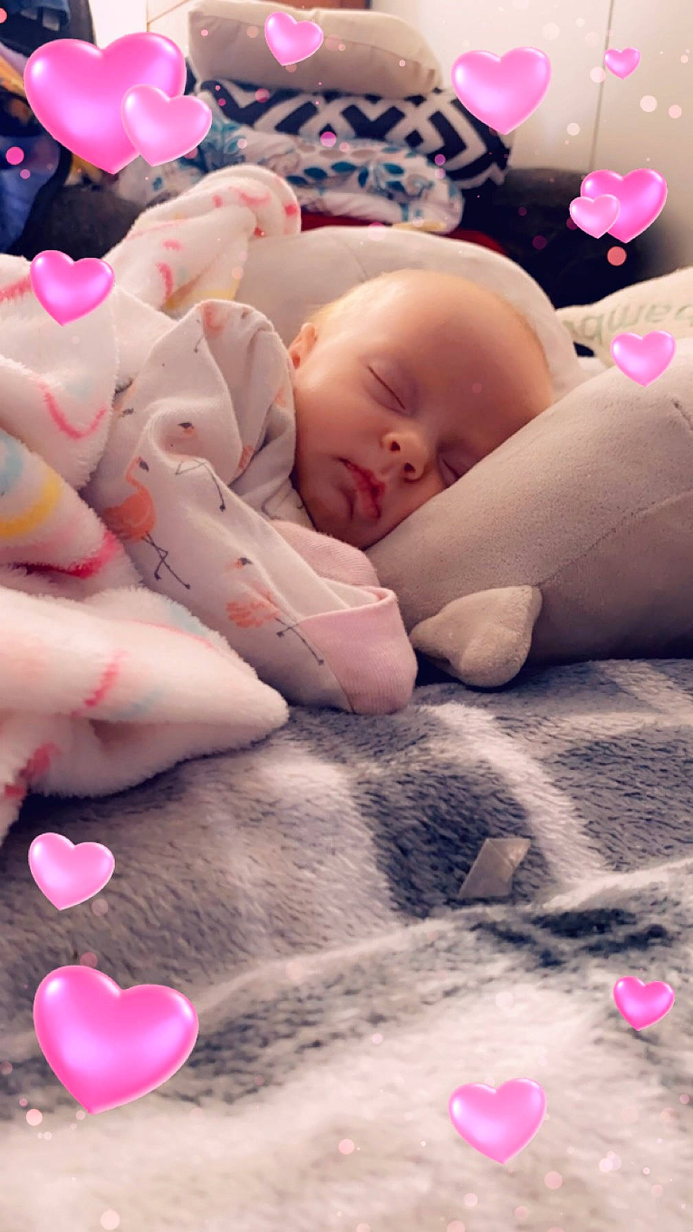 Evelyna is registered to the contest to win money with this photo: baby, baby_products, baby_sleeping, baby_toddler_clothing, bed, bedding, bedtime, cheek, comfort, finger, happy, linens, mouth, organ, person, petal, pink, skin, textile, toddler
