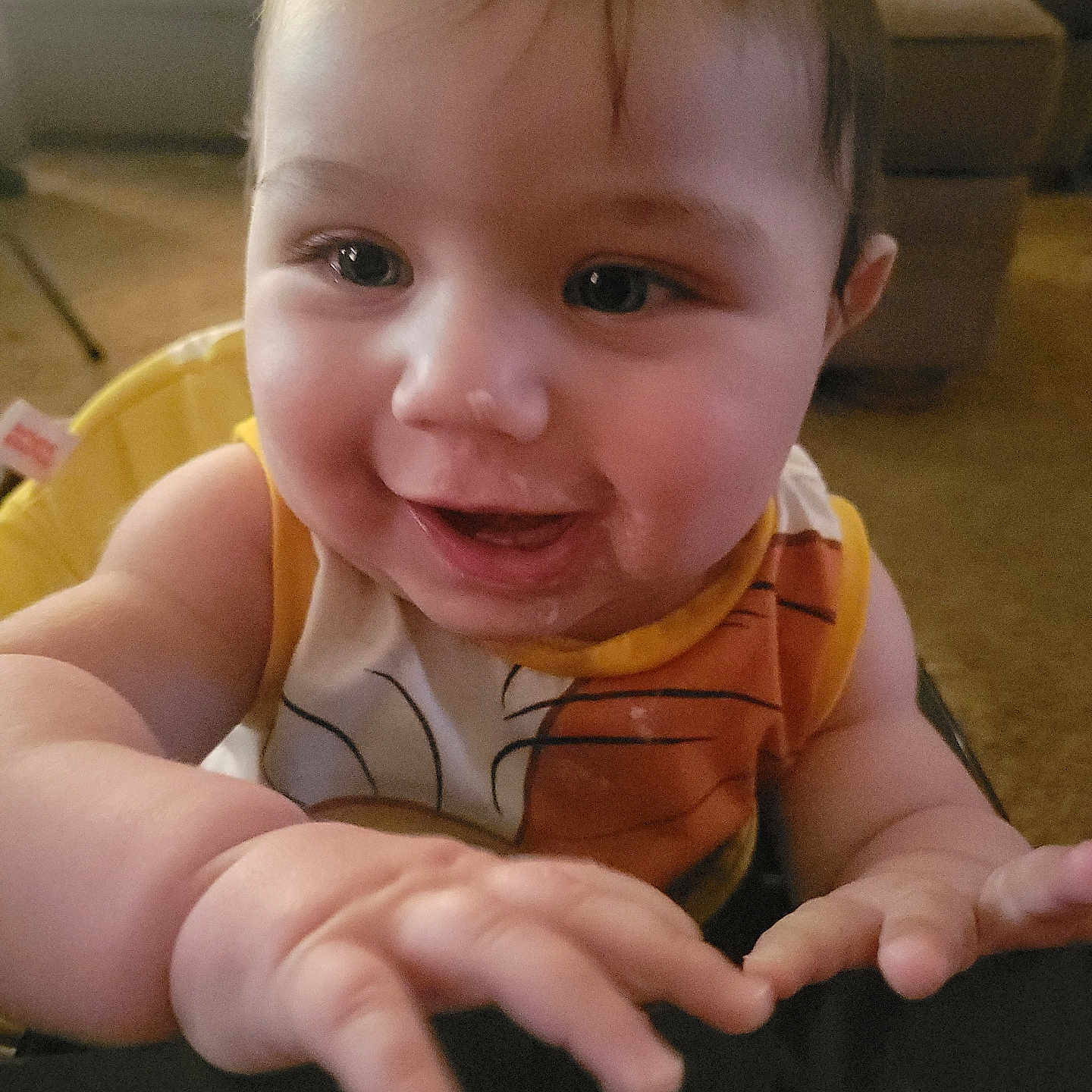 Fateh is registered to the contest to win money with this photo: baby, baby_clothes, bright_eyes, cheerful, child, closeup, couch, cute, face, furniture, hand, happy, indoor, infant, person, seated, skin, sleeveless_top, smiling, young_child