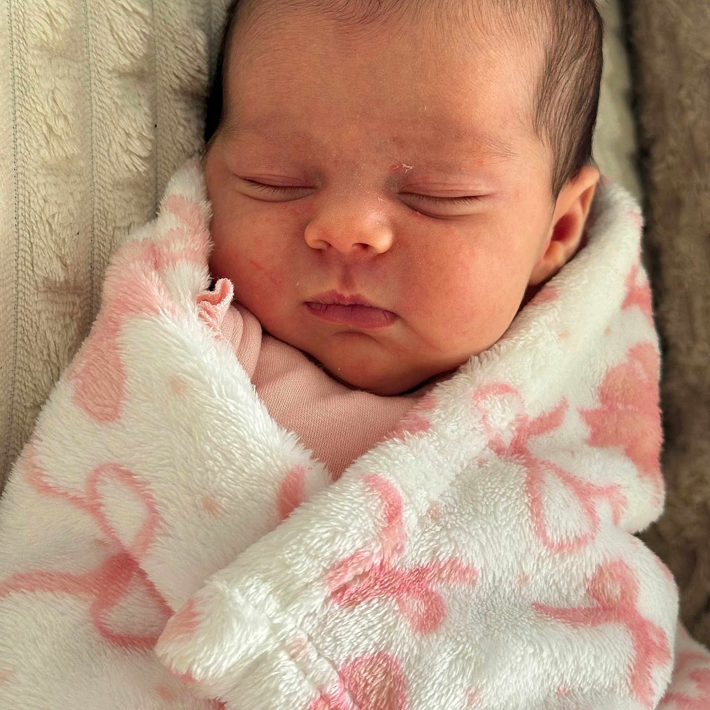 Gabriella is registered to the contest to win money with this photo: baby, blanket, child, closeup, cozy, cute, face, head, indoors, infant, newborn, peaceful, pink, portrait, resting, sleeping, soft, warm, white, wrapped