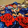 Amaziah is registered to the contest to win money with this photo: toddler, child, bed, blanket, red_rose, blue, cap, clothing, hanger, window, curtains, diapers, sitting, indoor, person, young_child, curious, pattern, soft_toys, casual